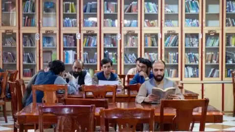 Afghanistan's rulers ban textbooks produced by female authors from the nation's colleges